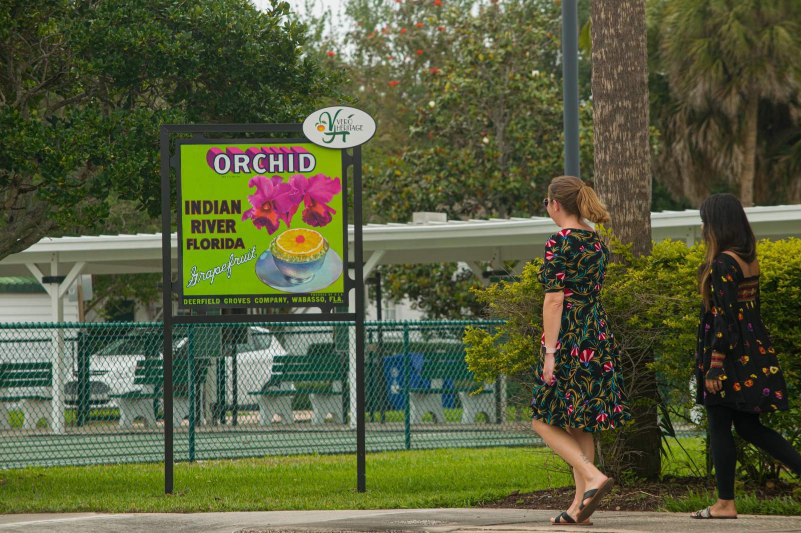 A women looking at a sign that says Orchid